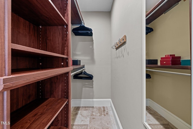 1501 Chatsworth Ln, Raleigh, NC 27614 - walk in closet with stone finish flooring