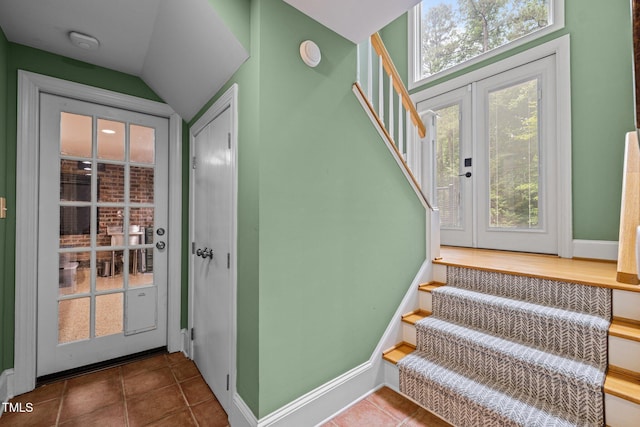 1501 Chatsworth Ln, Raleigh, NC 27614 - stairs with baseboards, tile patterned flooring, and lofted ceiling