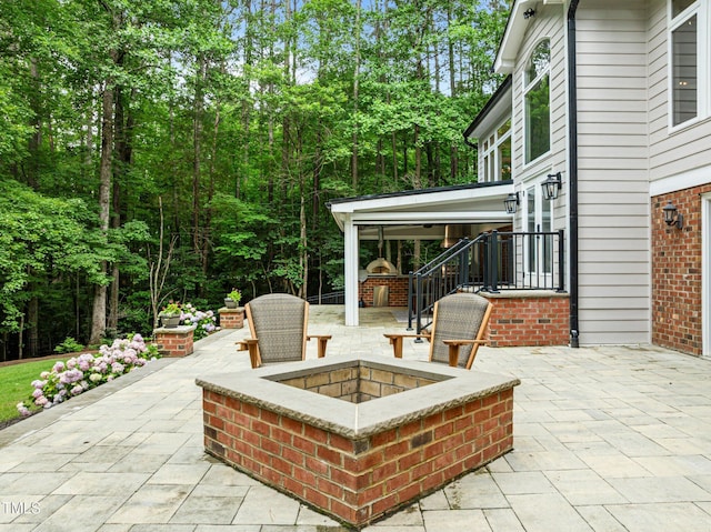 1501 Chatsworth Ln, Raleigh, NC 27614 - view of patio featuring an outdoor fire pit
