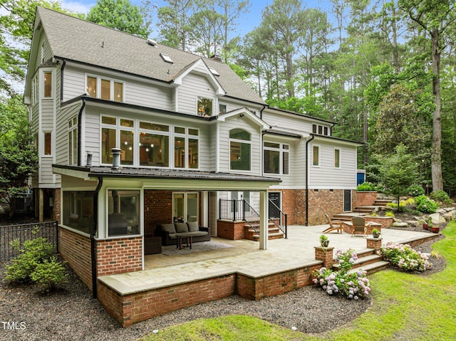 1501 Chatsworth Ln, Raleigh, NC 27614 - back of house with a patio area, brick siding, and a shingled roof