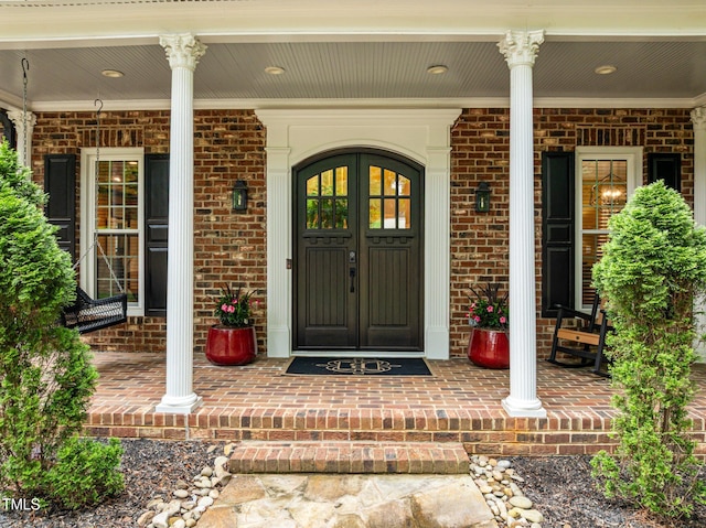 1501 Chatsworth Ln, Raleigh, NC 27614 - view of exterior entry featuring covered porch and brick siding