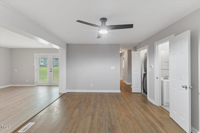 2752 Weldon Ter, Durham, NC 27703 - spare room with ceiling fan, baseboards, wood finished floors, and french doors