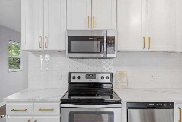 2752 Weldon Ter, Durham, NC 27703 - kitchen featuring stainless steel appliances, white cabinetry, and decorative backsplash