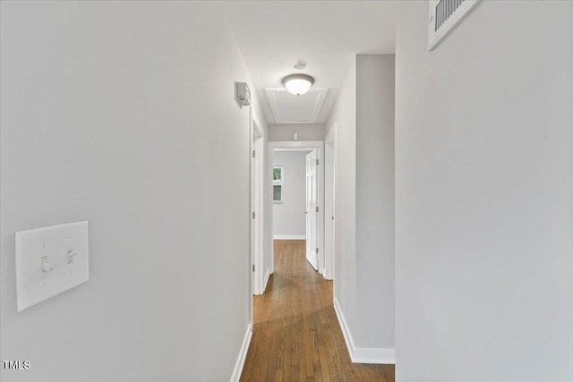 2752 Weldon Ter, Durham, NC 27703 - corridor featuring attic access, wood finished floors, and baseboards