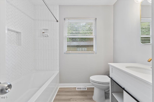 2752 Weldon Ter, Durham, NC 27703 - full bath featuring vanity, toilet, wood finished floors, and shower / bathtub combination