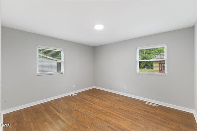 2752 Weldon Ter, Durham, NC 27703 - spare room featuring plenty of natural light, wood finished floors, and baseboards