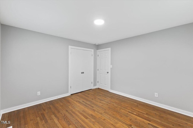 2752 Weldon Ter, Durham, NC 27703 - unfurnished room with baseboards and wood finished floors