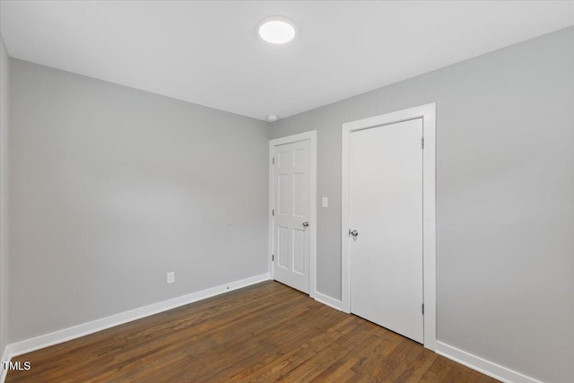 2752 Weldon Ter, Durham, NC 27703 - unfurnished bedroom with wood finished floors and baseboards