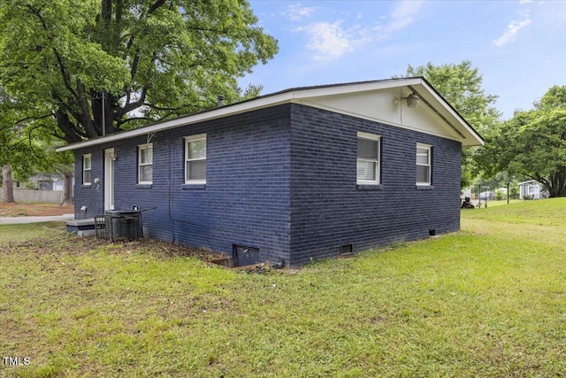 2752 Weldon Ter, Durham, NC 27703 - view of side of home featuring crawl space, a yard, central AC unit, and brick siding