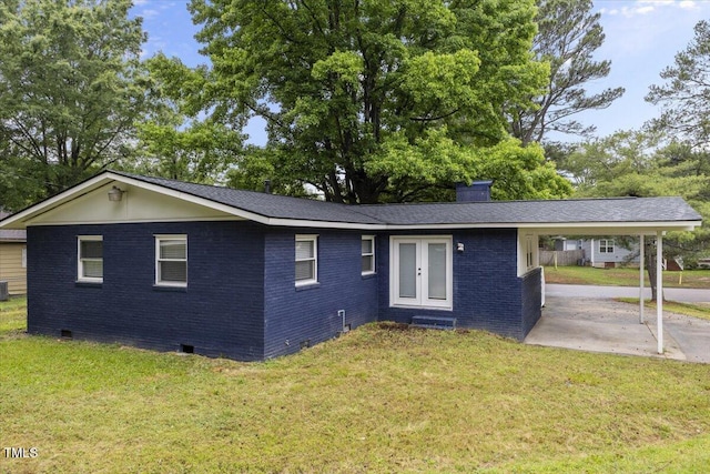 2752 Weldon Ter, Durham, NC 27703 - ranch-style house with crawl space, french doors, brick siding, a front lawn, and a chimney