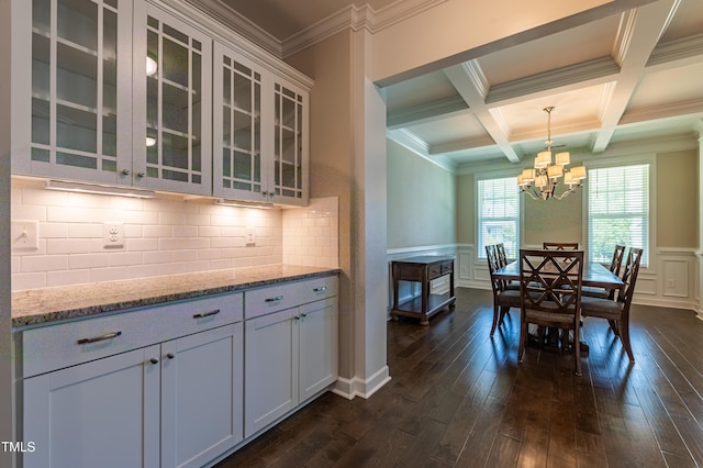 367 Tayside St, Clayton, NC 27520 - dining room featuring beam ceiling, dark wood-style flooring, a chandelier, ornamental molding, and a decorative wall
