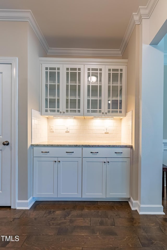 367 Tayside St, Clayton, NC 27520 - bar area with baseboards, ornamental molding, dark wood-style flooring, and decorative backsplash