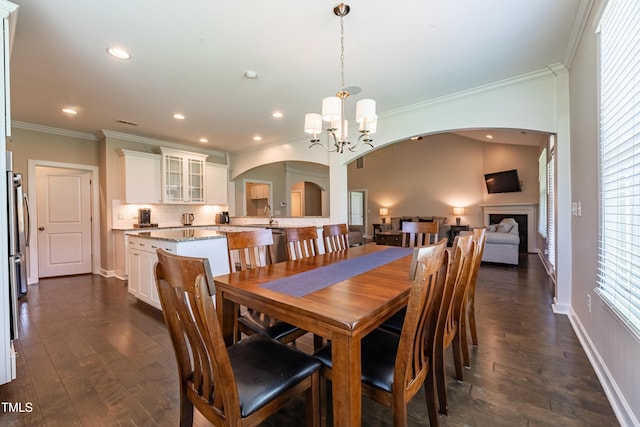 367 Tayside St, Clayton, NC 27520 - dining area featuring arched walkways, a chandelier, dark wood finished floors, ornamental molding, and recessed lighting