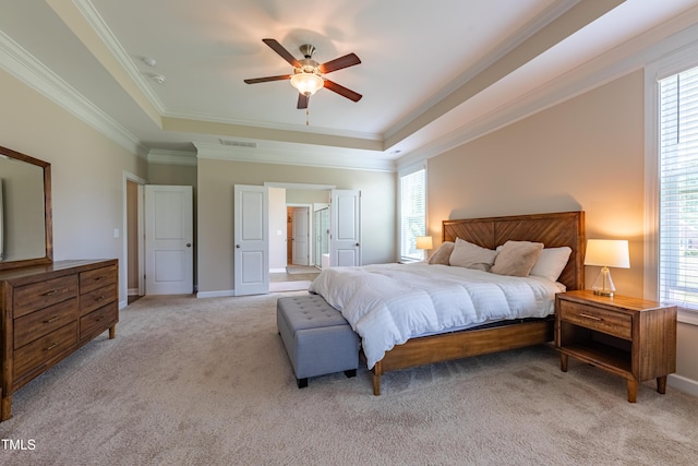 367 Tayside St, Clayton, NC 27520 - bedroom with a raised ceiling, multiple windows, light carpet, and crown molding