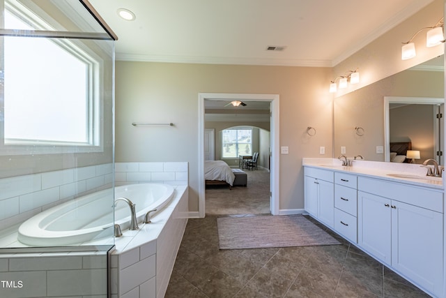 367 Tayside St, Clayton, NC 27520 - ensuite bathroom featuring double vanity, a garden tub, crown molding, tile patterned flooring, and baseboards