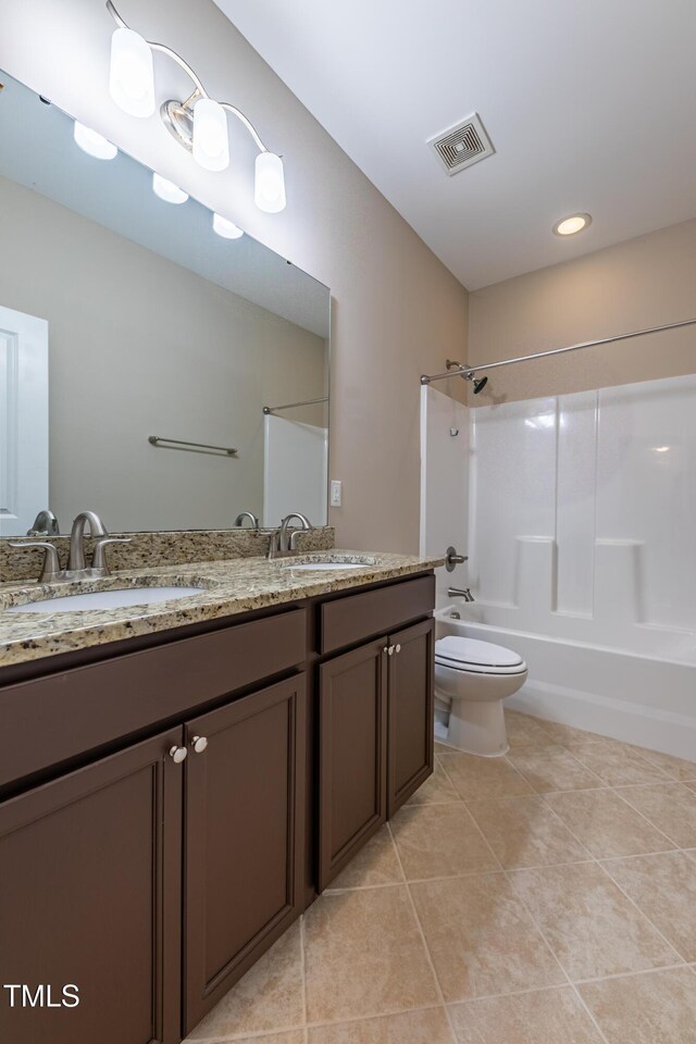367 Tayside St, Clayton, NC 27520 - full bathroom featuring shower / tub combination, double vanity, toilet, tile patterned floors, and recessed lighting