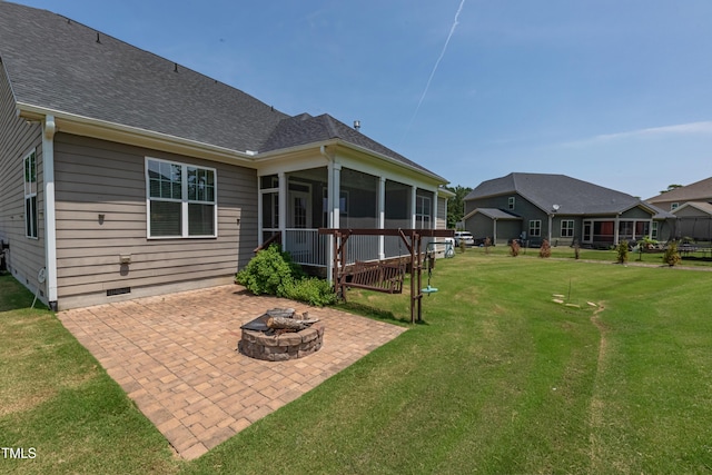 367 Tayside St, Clayton, NC 27520 - rear view of house featuring an outdoor fire pit, a sunroom, a patio area, a yard, and a shingled roof