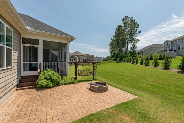 367 Tayside St, Clayton, NC 27520 - view of patio featuring a residential view, an outdoor fire pit, and a sunroom