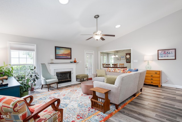 1113 Pilton Pl, Raleigh, NC 27604 - living room with wood finished floors, ceiling fan, vaulted ceiling, recessed lighting, and a high end fireplace