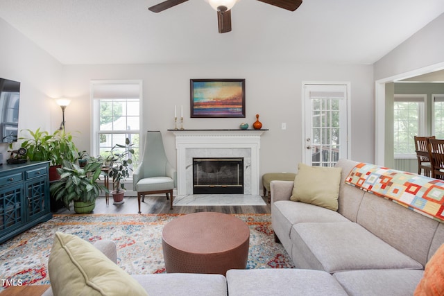 1113 Pilton Pl, Raleigh, NC 27604 - living area with wood finished floors, a ceiling fan, and a premium fireplace