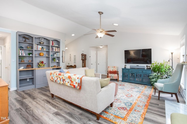 1113 Pilton Pl, Raleigh, NC 27604 - living area with vaulted ceiling, ceiling fan, light wood finished floors, and baseboards