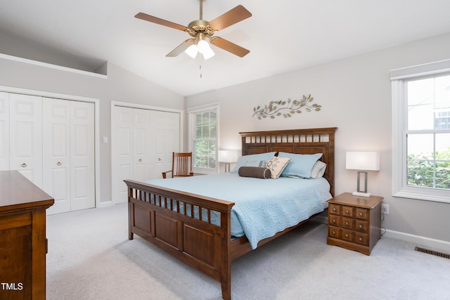 1113 Pilton Pl, Raleigh, NC 27604 - bedroom with multiple closets, carpet floors, lofted ceiling, baseboards, and ceiling fan
