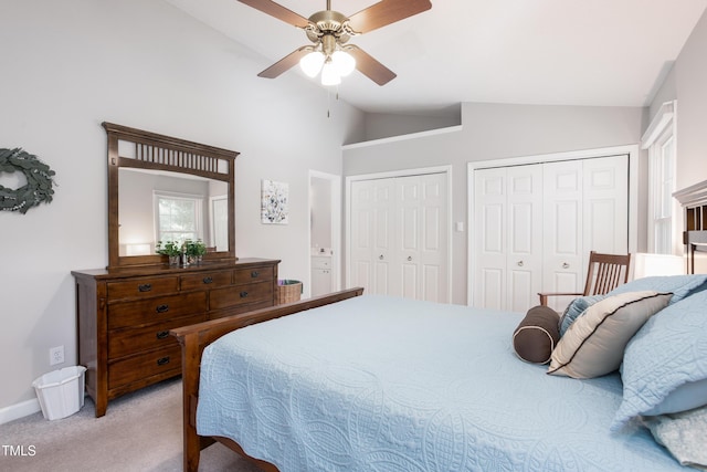 1113 Pilton Pl, Raleigh, NC 27604 - bedroom with lofted ceiling, two closets, light carpet, baseboards, and ceiling fan