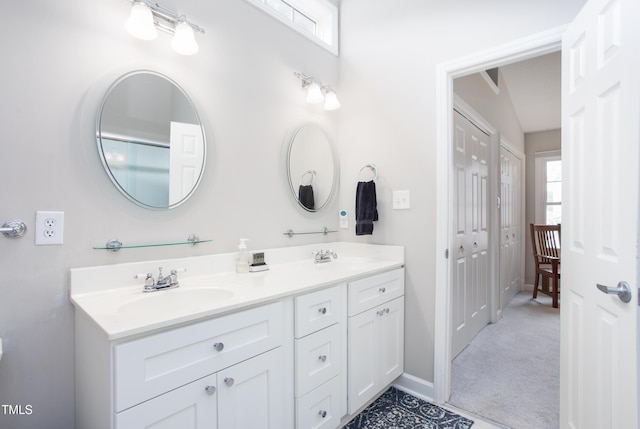 1113 Pilton Pl, Raleigh, NC 27604 - full bath with double vanity, plenty of natural light, and baseboards