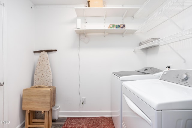 1113 Pilton Pl, Raleigh, NC 27604 - laundry area with washing machine and clothes dryer, baseboards, and wood finished floors