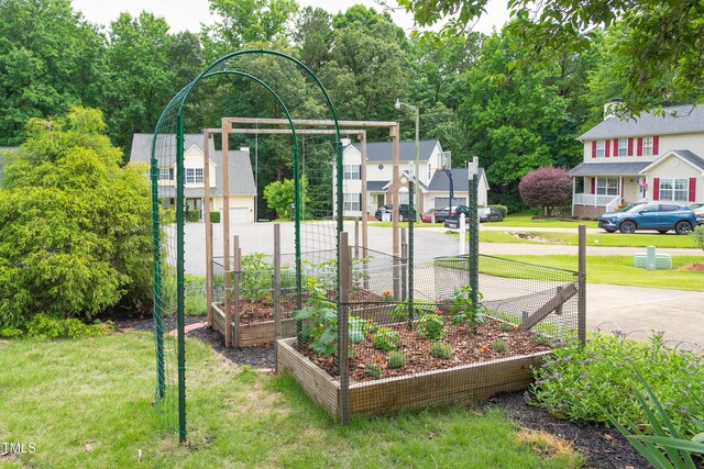1113 Pilton Pl, Raleigh, NC 27604 - view of green lawn featuring a vegetable garden