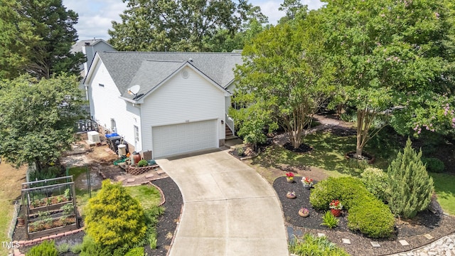 1113 Pilton Pl, Raleigh, NC 27604 - view of front of home with concrete driveway, a shingled roof, and a garage