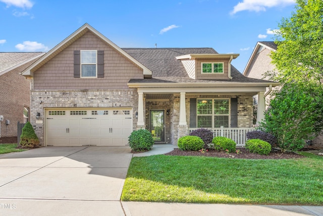 4110 Argyle Trl, Burlington, NC 27215 - craftsman-style house featuring a porch, concrete driveway, a front lawn, and a shingled roof