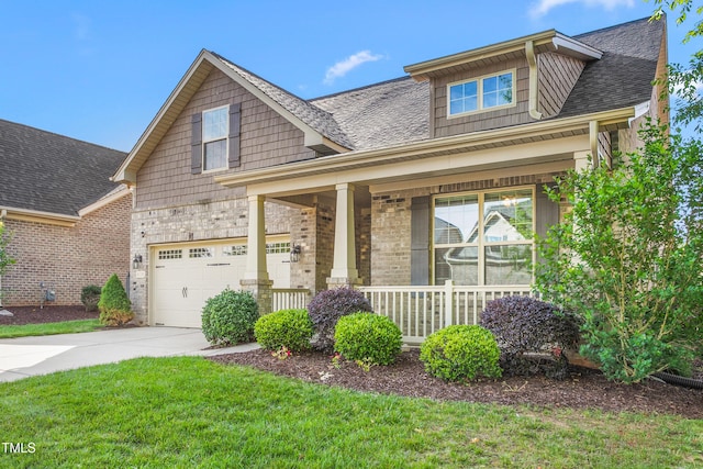 4110 Argyle Trl, Burlington, NC 27215 - craftsman-style home featuring covered porch, concrete driveway, a shingled roof, a front yard, and brick siding