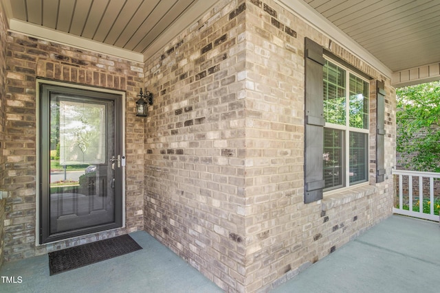 4110 Argyle Trl, Burlington, NC 27215 - view of exterior entry with a porch and brick siding