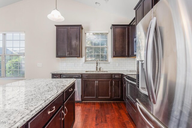 4110 Argyle Trl, Burlington, NC 27215 - kitchen featuring stainless steel appliances, a sink, lofted ceiling, plenty of natural light, and dark wood-type flooring