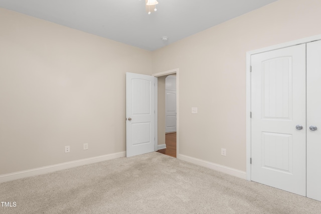 4110 Argyle Trl, Burlington, NC 27215 - unfurnished bedroom featuring carpet, baseboards, and a closet