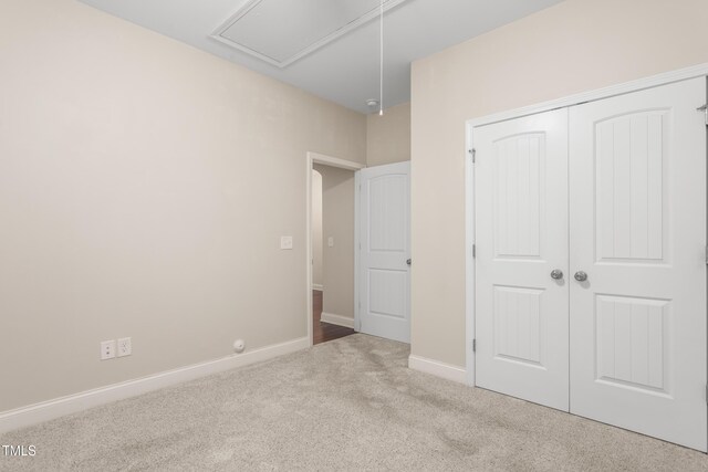 4110 Argyle Trl, Burlington, NC 27215 - unfurnished bedroom with attic access, carpet, a closet, and baseboards