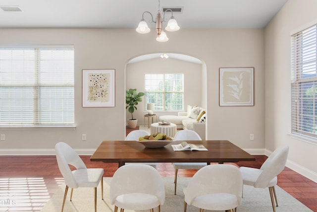4110 Argyle Trl, Burlington, NC 27215 - dining area with wood finished floors, plenty of natural light, a chandelier, and baseboards