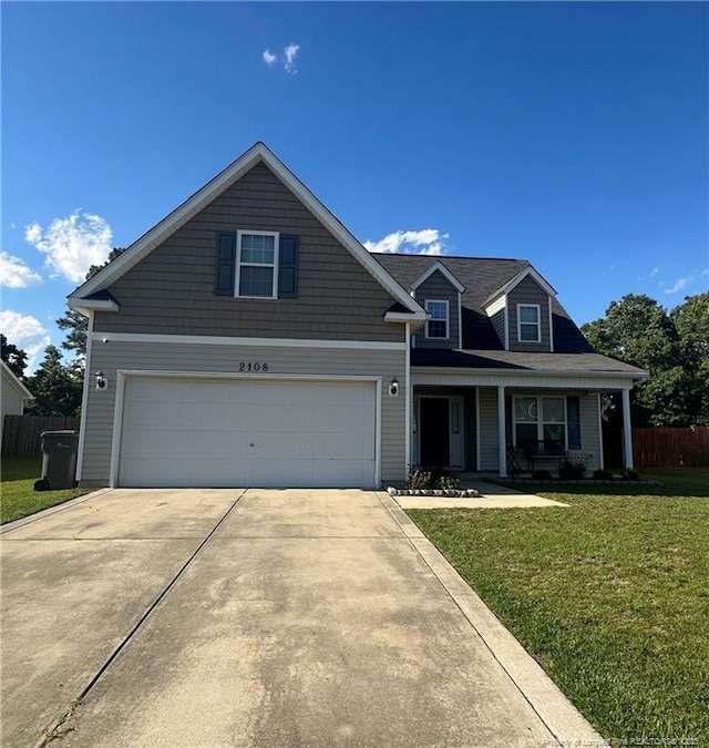 2108 Sir Michael Dr, Hope Mills, NC 28348 - traditional-style house featuring a garage, concrete driveway, and covered porch