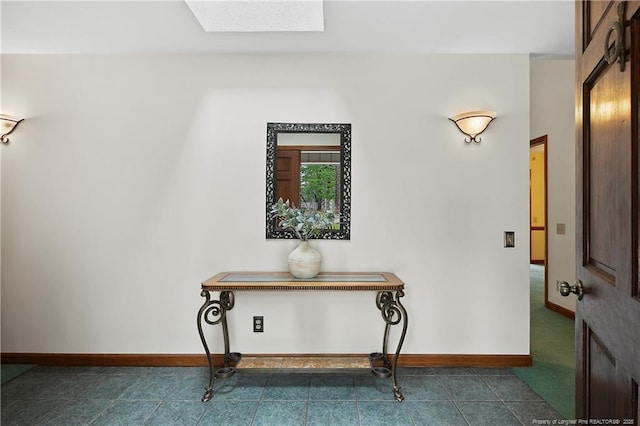 38 E Lndg, Sanford, NC 27332 - hallway with a skylight, dark tile patterned floors, and baseboards