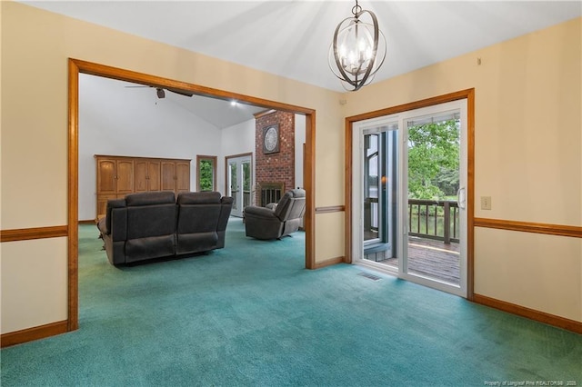 38 E Lndg, Sanford, NC 27332 - carpeted foyer entrance featuring healthy amount of natural light, a chandelier, baseboards, lofted ceiling, and a fireplace