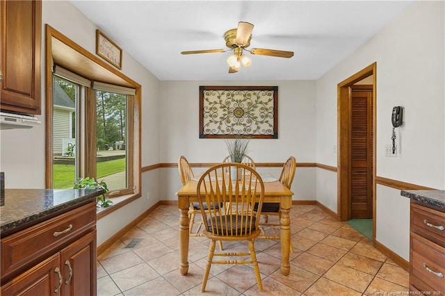 38 E Lndg, Sanford, NC 27332 - dining area featuring ceiling fan, light tile patterned floors, and baseboards