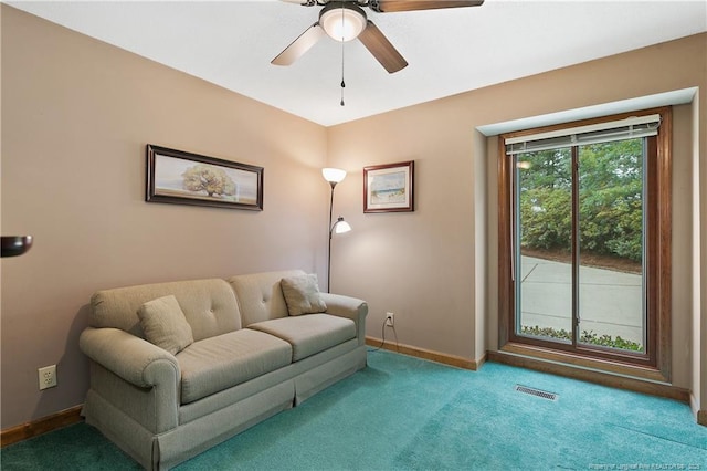 38 E Lndg, Sanford, NC 27332 - carpeted living room featuring a ceiling fan and baseboards