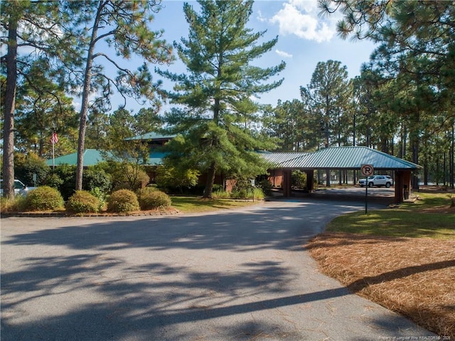 38 E Lndg, Sanford, NC 27332 - view of front of property with driveway, a carport, and metal roof