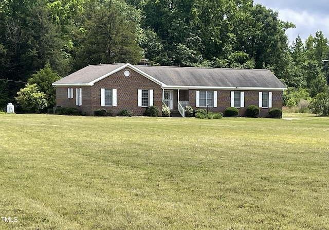 65 Opie Frazier Rd, Henderson, NC 27537 - ranch-style house with a front yard and brick siding