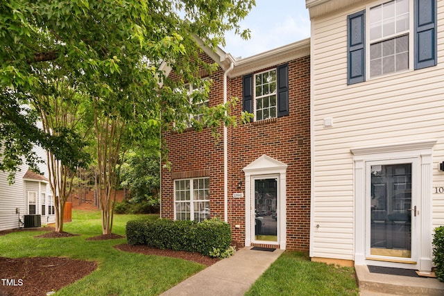 10941 Pendragon Pl, Raleigh, NC 27614 - multi unit property featuring a front yard, brick siding, and central AC unit