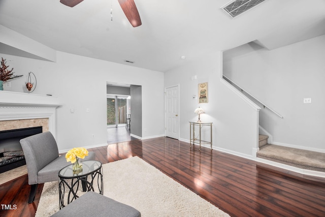 10941 Pendragon Pl, Raleigh, NC 27614 - living room featuring hardwood / wood-style floors, stairway, a ceiling fan, baseboards, and a fireplace