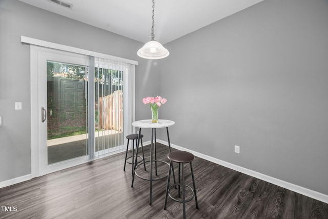 10941 Pendragon Pl, Raleigh, NC 27614 - dining space featuring dark wood-style flooring and baseboards