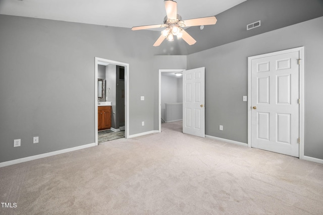 10941 Pendragon Pl, Raleigh, NC 27614 - unfurnished bedroom with light colored carpet, a spacious closet, baseboards, connected bathroom, and ceiling fan