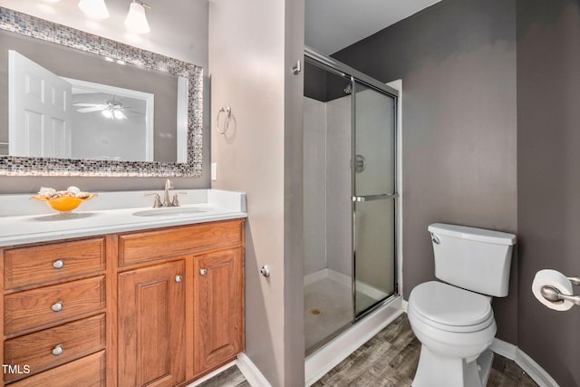 10941 Pendragon Pl, Raleigh, NC 27614 - full bath with toilet, a stall shower, vanity, and wood finished floors